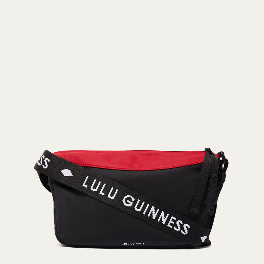 Black and red bag with 'Lulu Guinness' branding on a white background