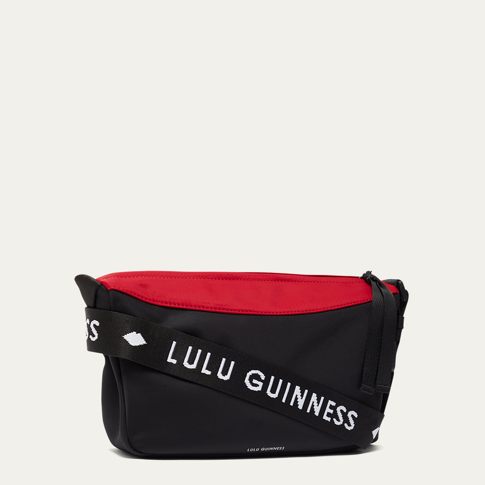 Black and red bag with 'Lulu Guinness' branding on a white background