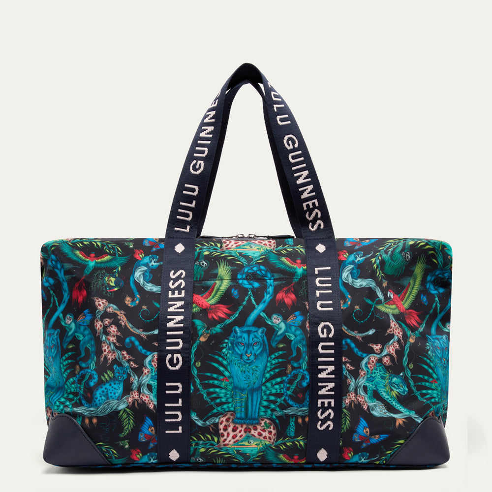Colorful patterned duffle bay  by Lulu Guinness x Emma Shipley with 'Lulu Guinness' branding on a white background