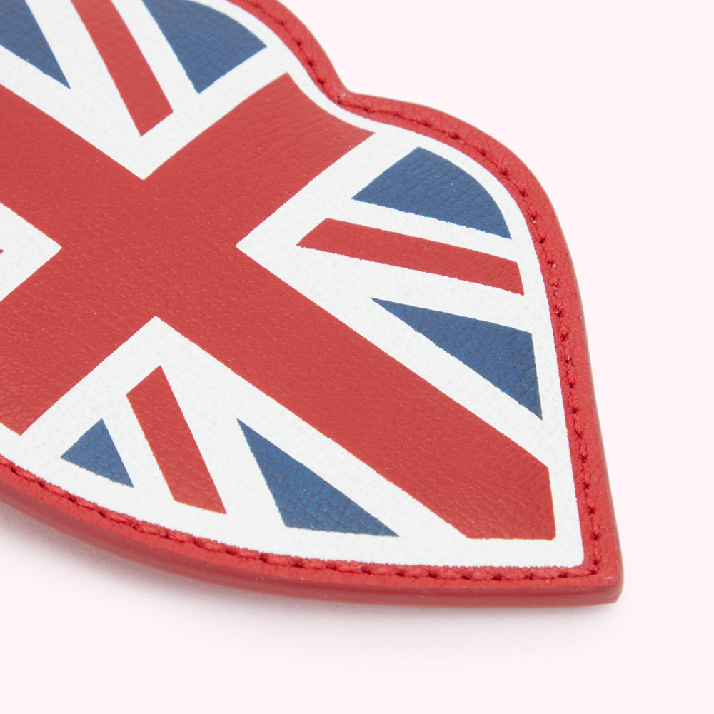 A close up image of a red leather luggage tag with a union jack print.