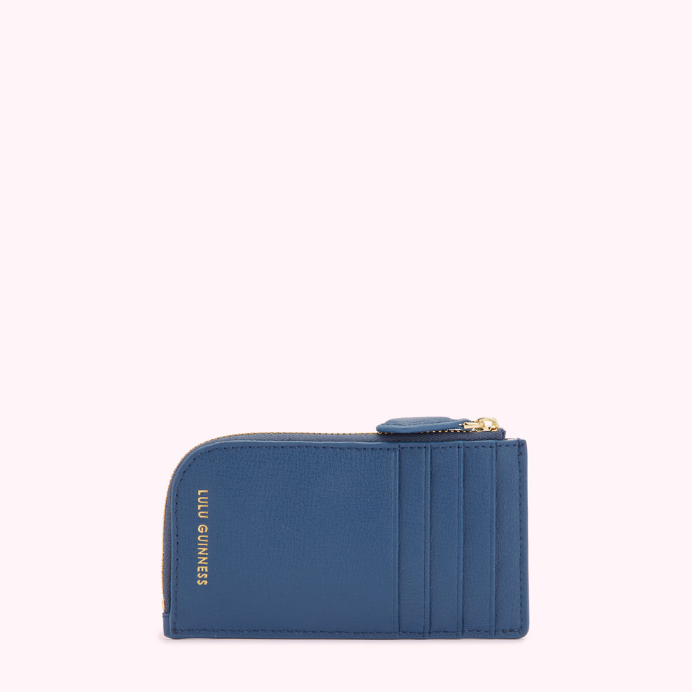 Blue Lulu Guinness zip-around card holder against a white background.
