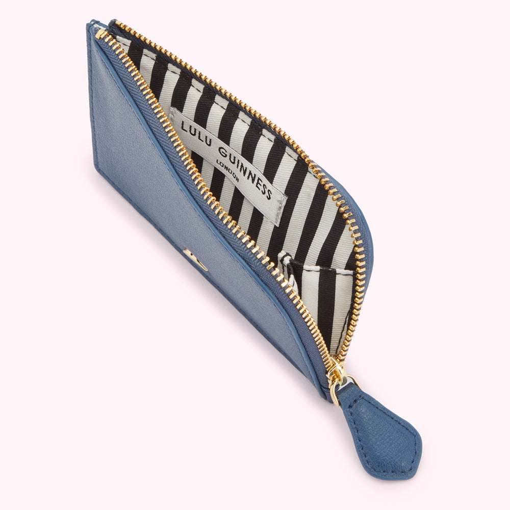 Open blue Lulu Guinness zip-around cardholder with black and white striped interior.
