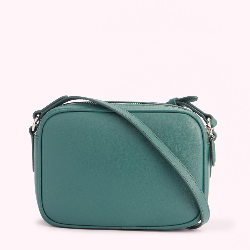 Teal leather crossbody bag with a silver zipper.

