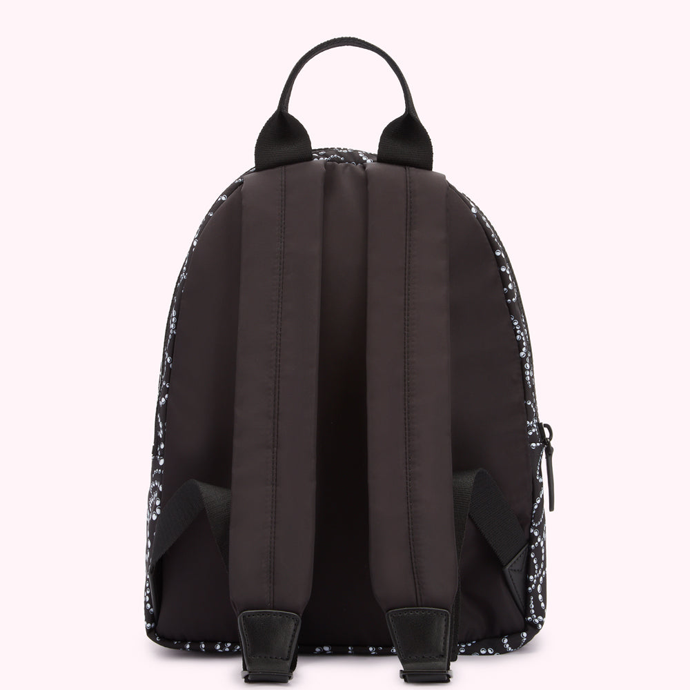 Back view of a black backpack with a white pattern.
