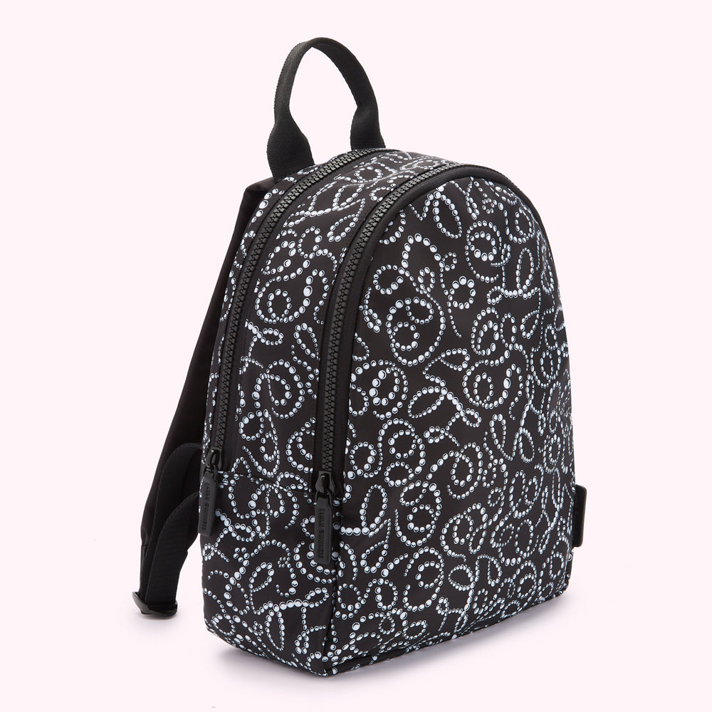 Black mini backpack with white pearl pattern.