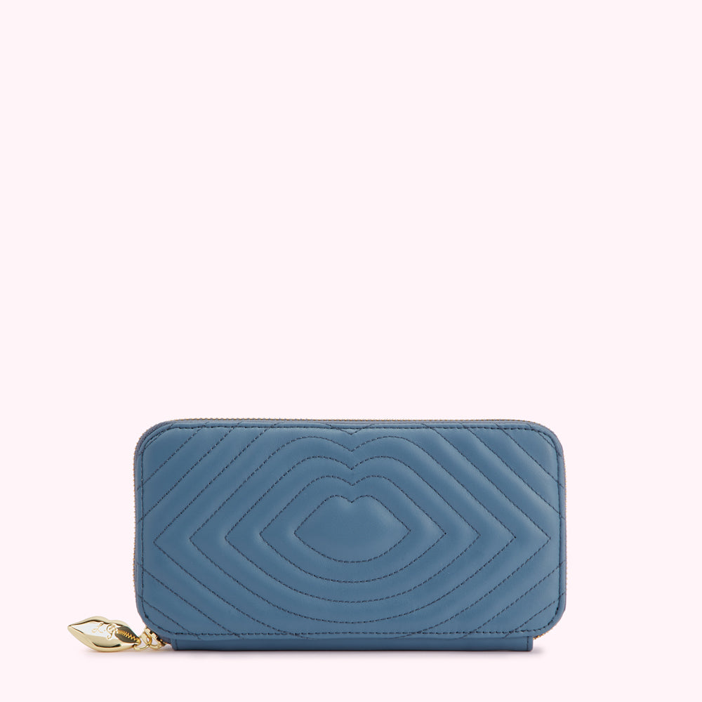 Blue quilted zip-around wallet with heart-shaped pattern.
