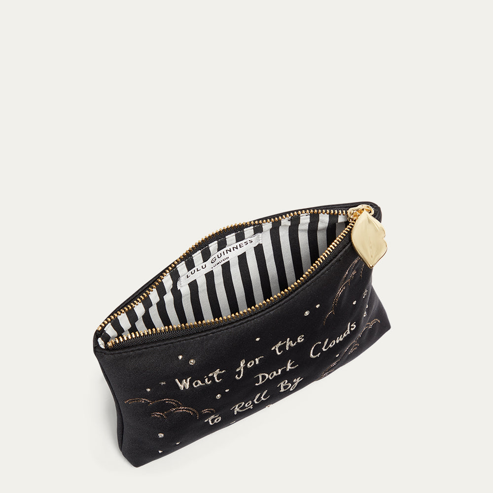 Black satin pouch with gold text and a striped interior on a white background