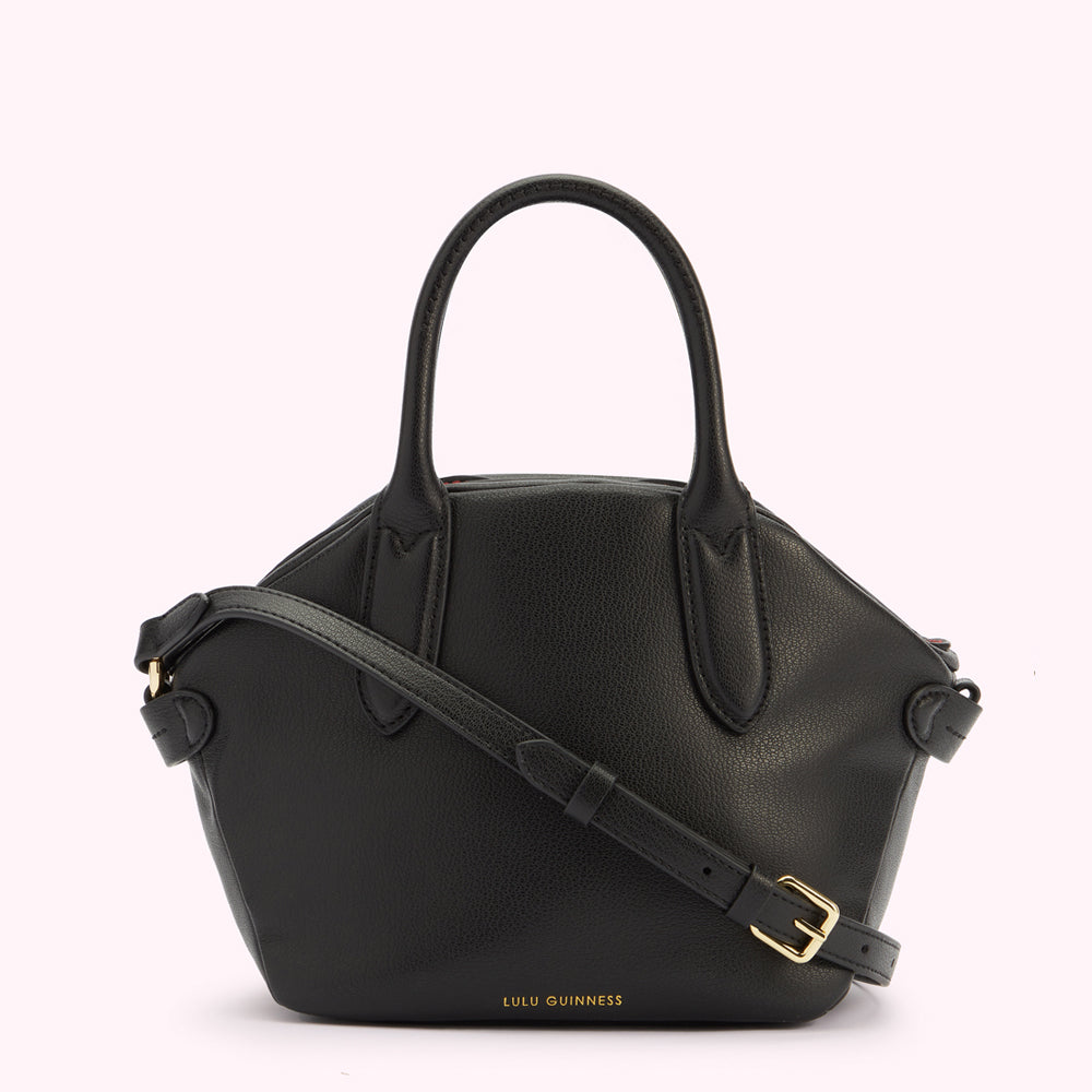 A front image of a black leather handbag with a top handle and a gold foil Lulu Guinness logo.