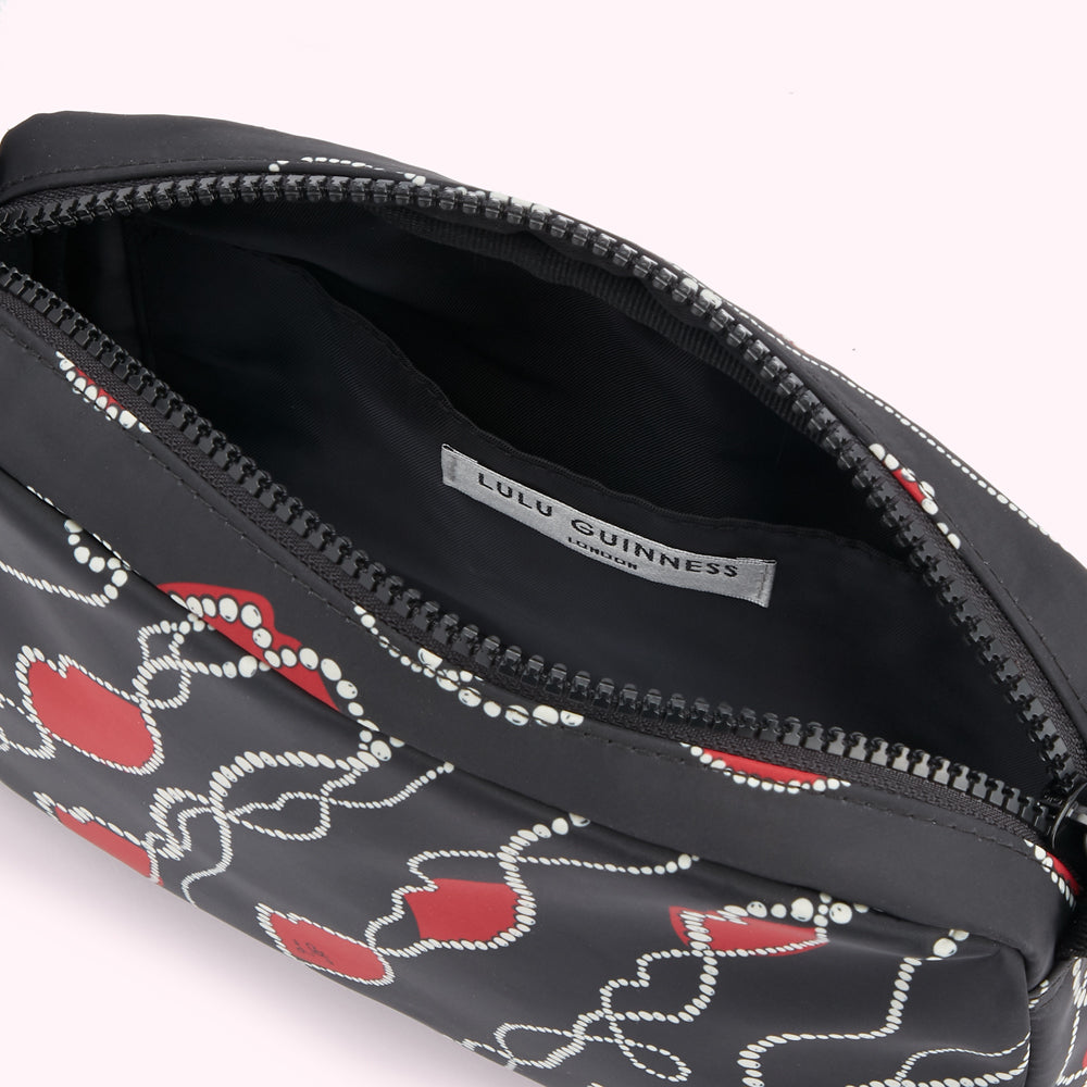 Open Lulu Guinness black pouch with red heart and chain print.

