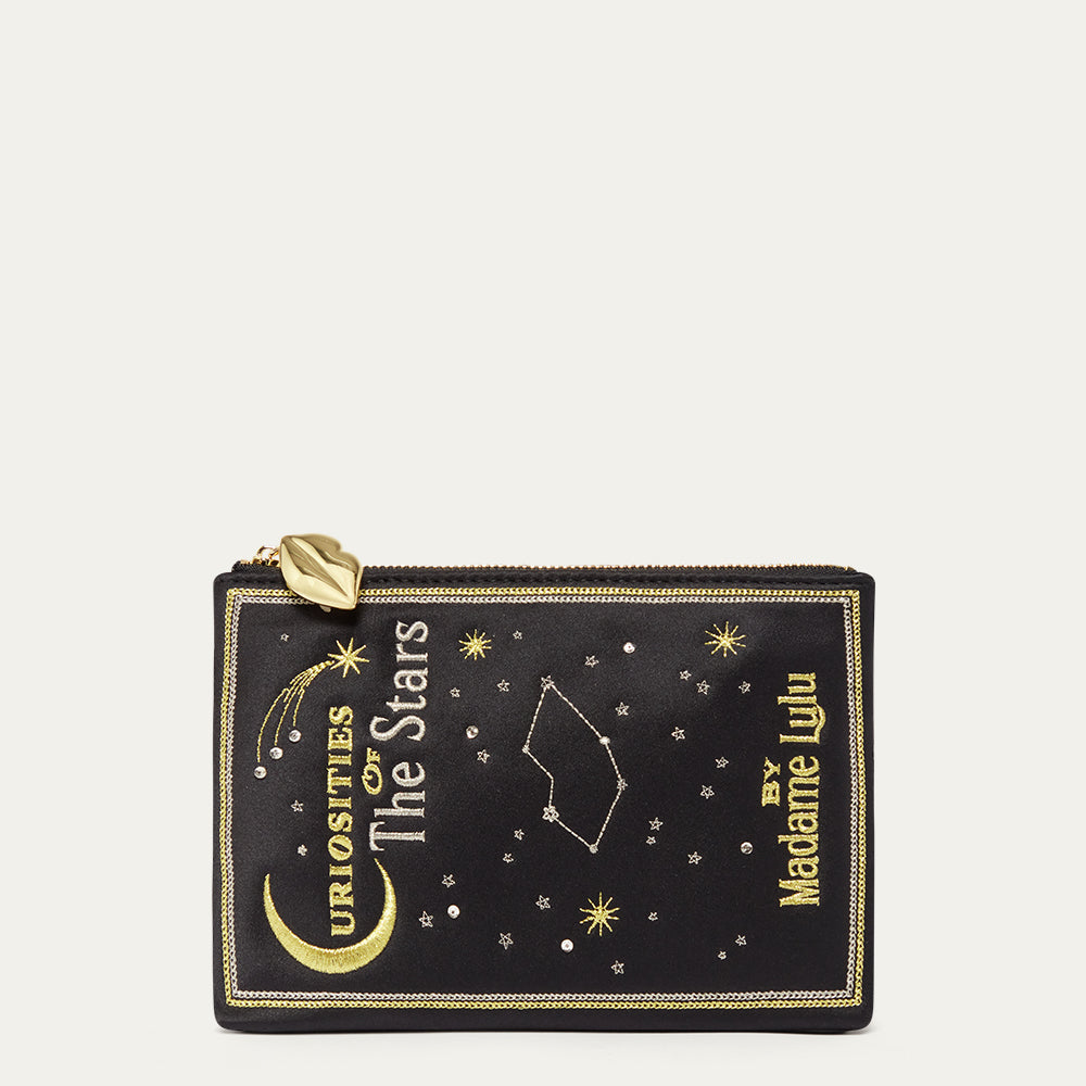 Black satin pouch with star constellations and 'Madame Lulu' branding on a beige background
