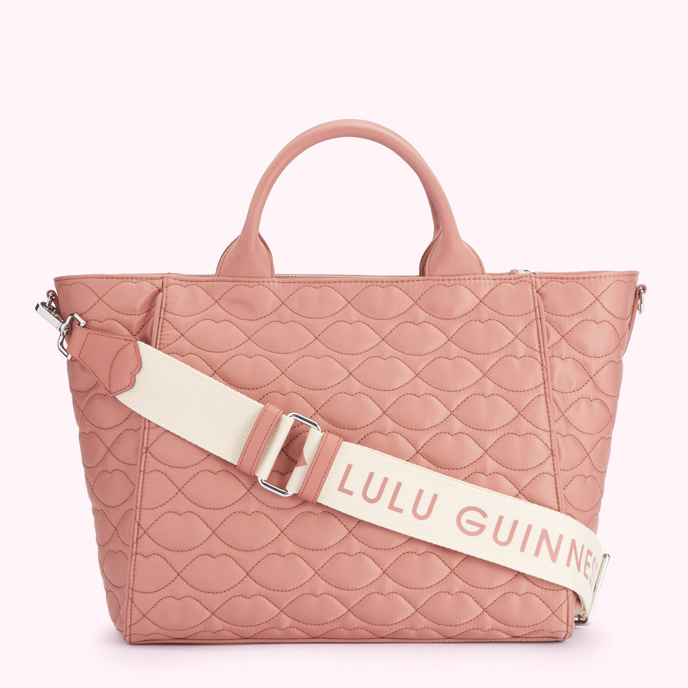 Dusty rose quilted tote bag with a cream Lulu Guinness strap.
