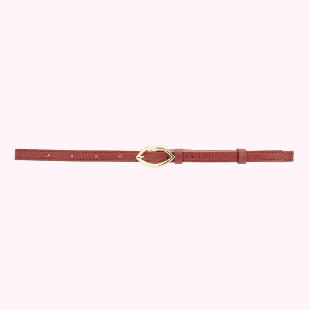 Tan brown leather belt showing a gold lip shaped buckle.