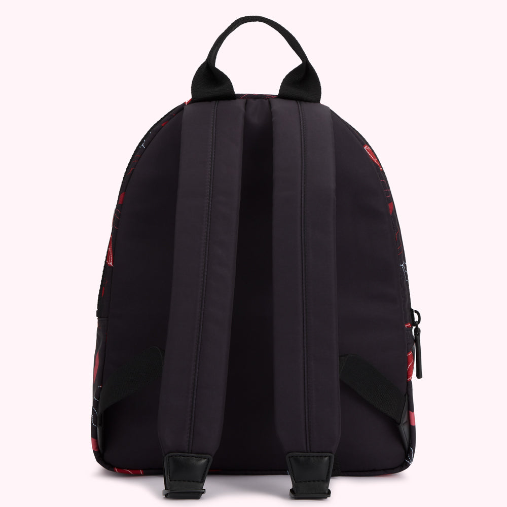 Black backpack with red and white graphic print, shown from the back.
