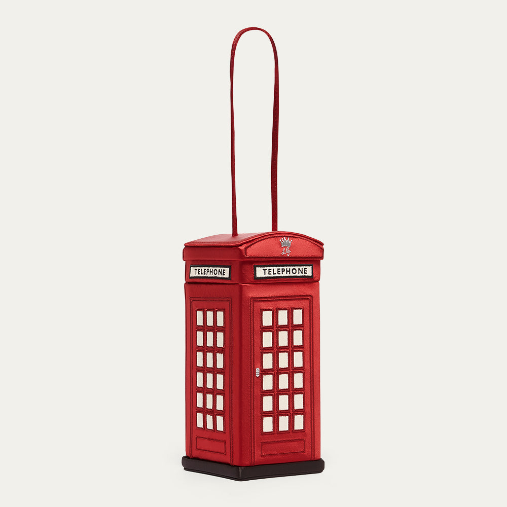 Red telephone booth-shaped bag on a white background