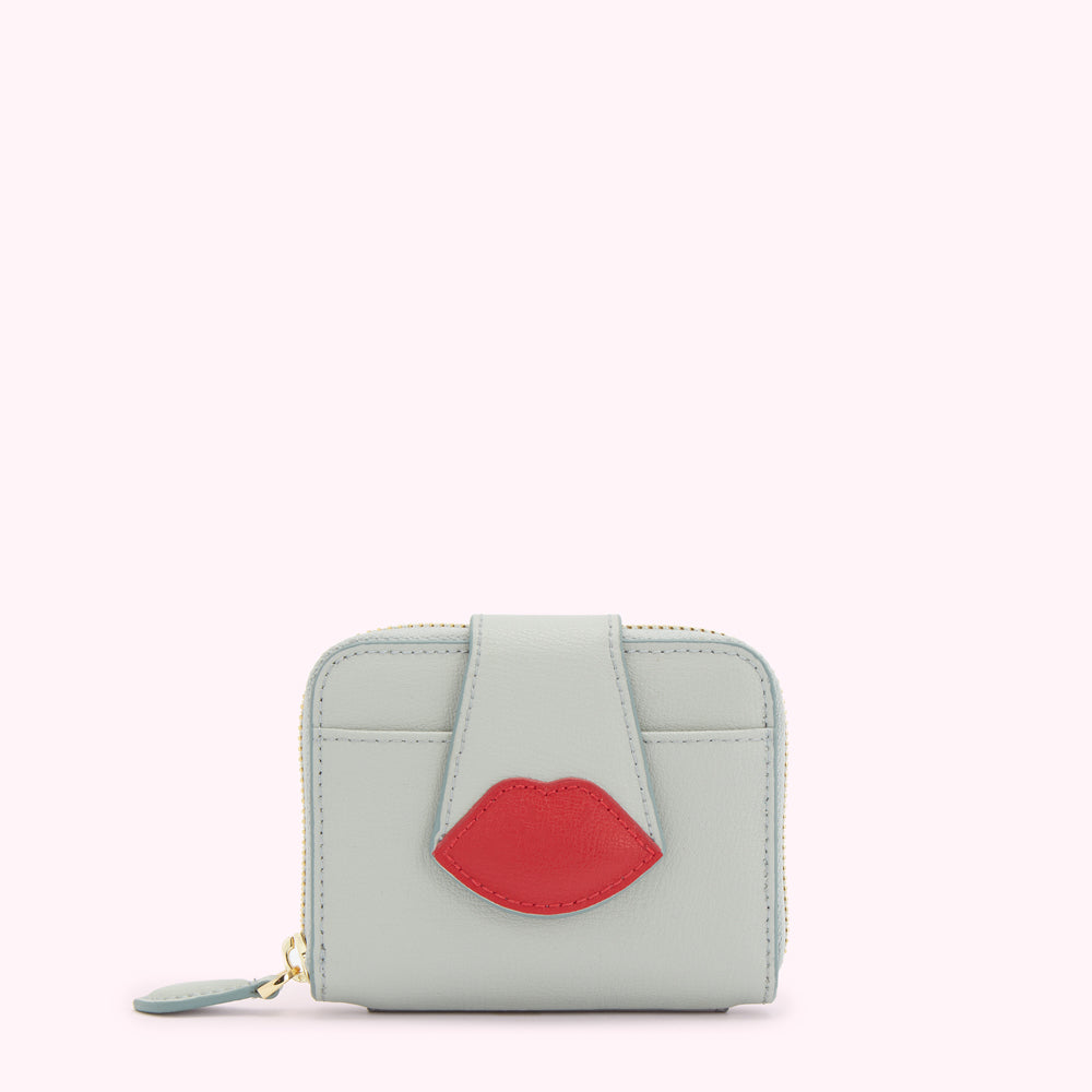 Light blue leather wallet with a red lip detail.
