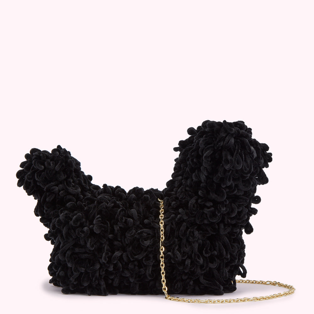 Black velvet dog-shaped bag with gold chain strap.
