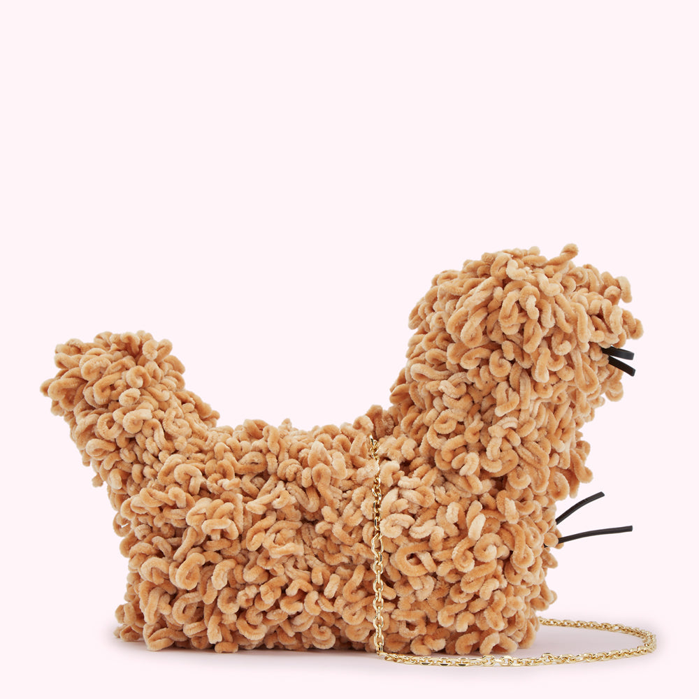 Tan, fluffy, dog-shaped handbag with a gold chain strap.
