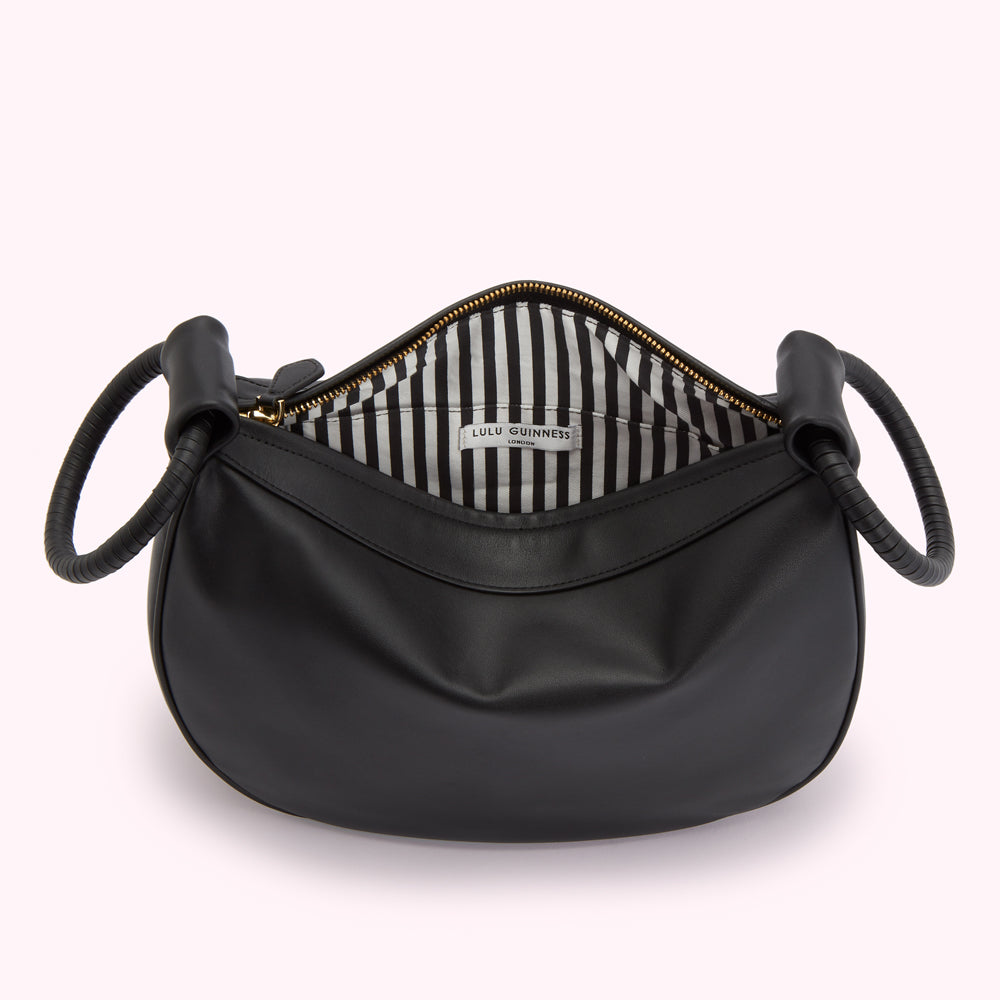 Black Lulu Guinness London handbag with gold-toned hardware and black and white striped interior lining.