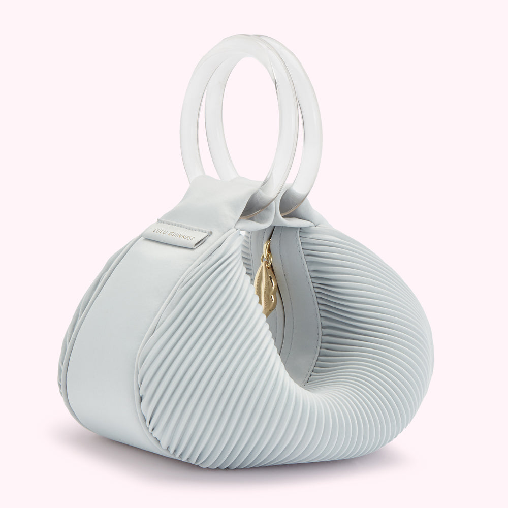 Light blue pleated Lulu Guinness handbag with clear Perspex handles.
