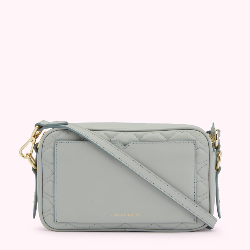 Light blue quilted crossbody bag by Lulu Guinness.
