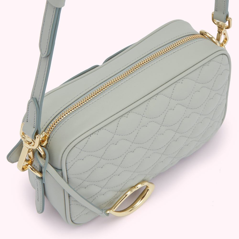 Light blue quilted leather crossbody bag with gold hardware.