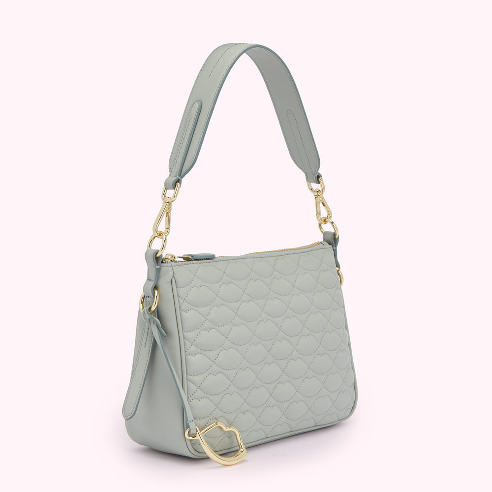 Light blue quilted shoulder bag with gold hardware.
