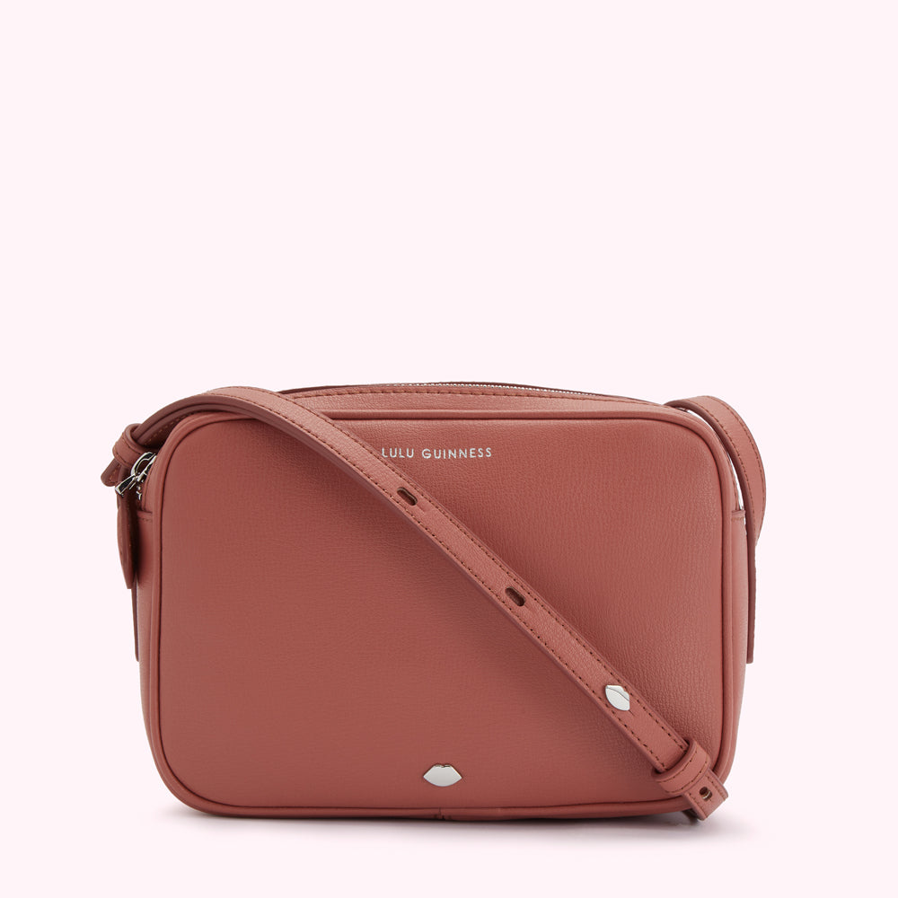 Dusty rose Lulu Guinness crossbody bag with silver-toned hardware.