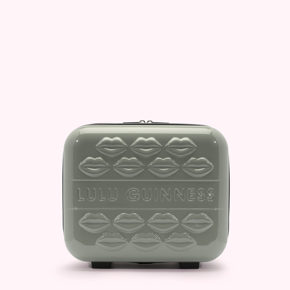 Sage green Lulu Guinness makeup case with embossed lips.