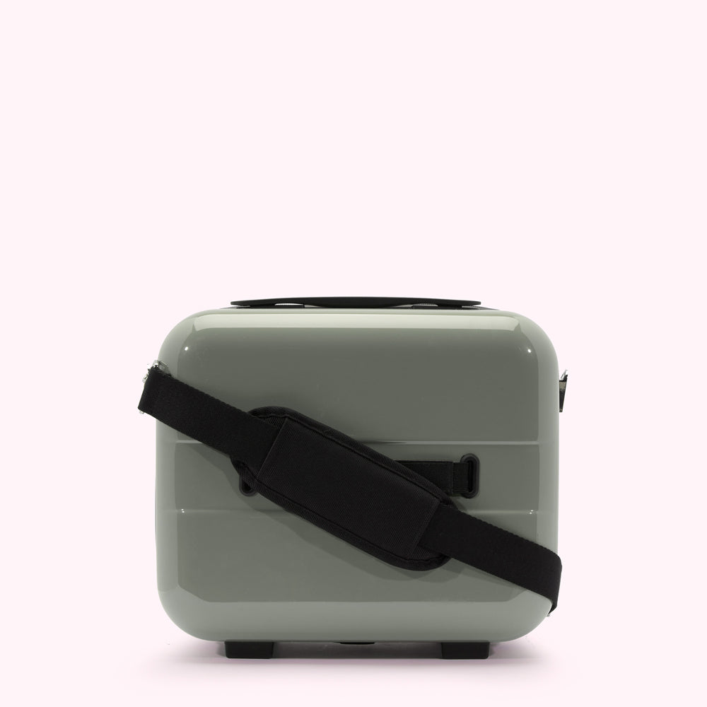 Sage green carry-on suitcase with black shoulder strap.
