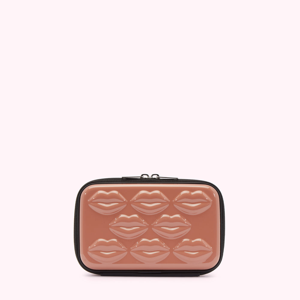 Dusty rose cosmetic bag with a black zipper and lips moulded into the case.
