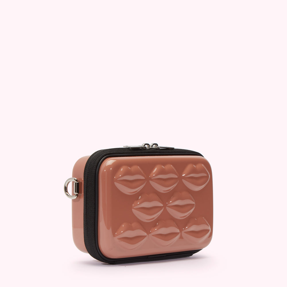 Dusty rose pink crossbody bag with moulded lips on the front.
