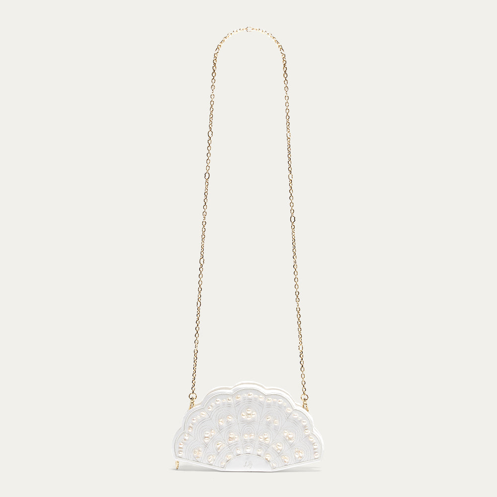 A white satin fan-shaped handbag with gold chain strap on a light gray background
