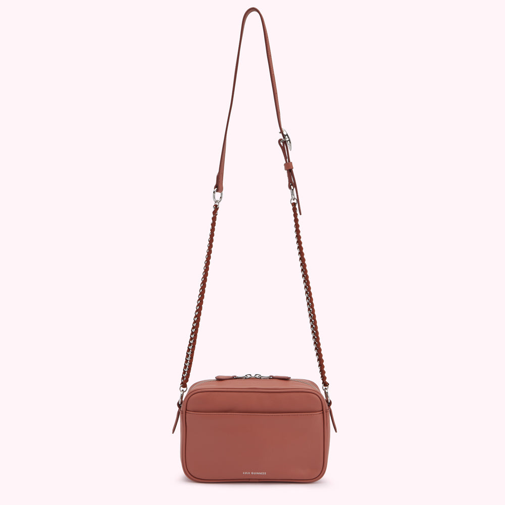 Dusty rose crossbody bag with a chain strap.