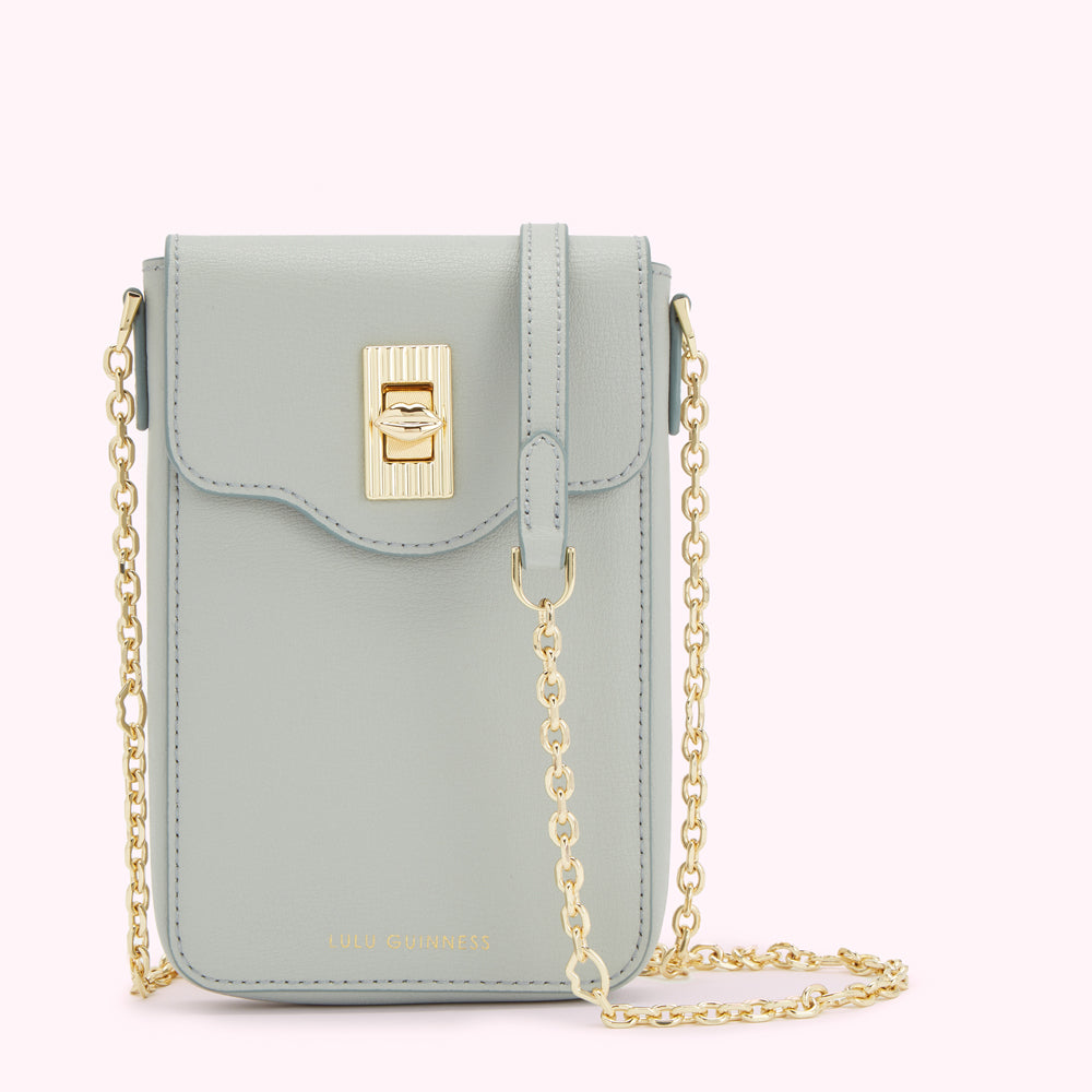 Light blue leather crossbody bag with gold chain strap and clasp.