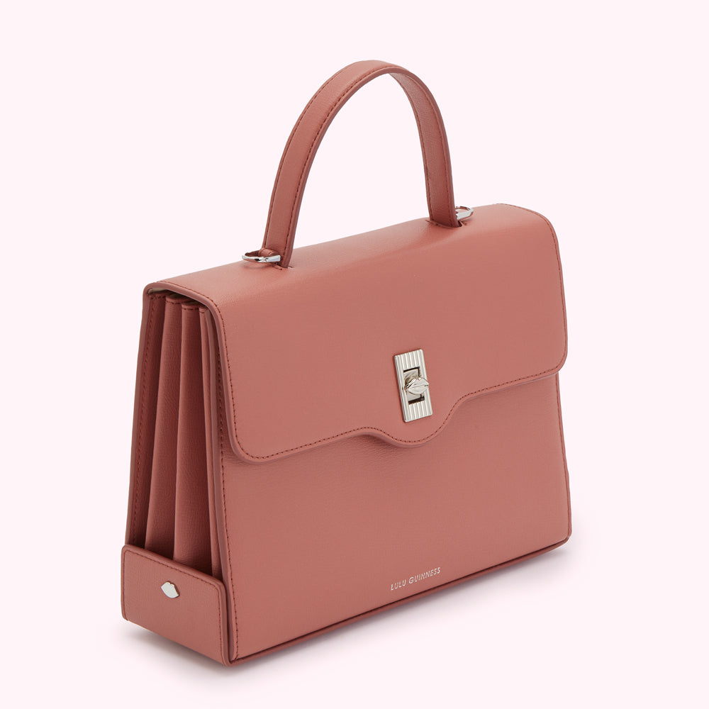Dusty rose Lulu Guinness leather handbag with silver hardware.
