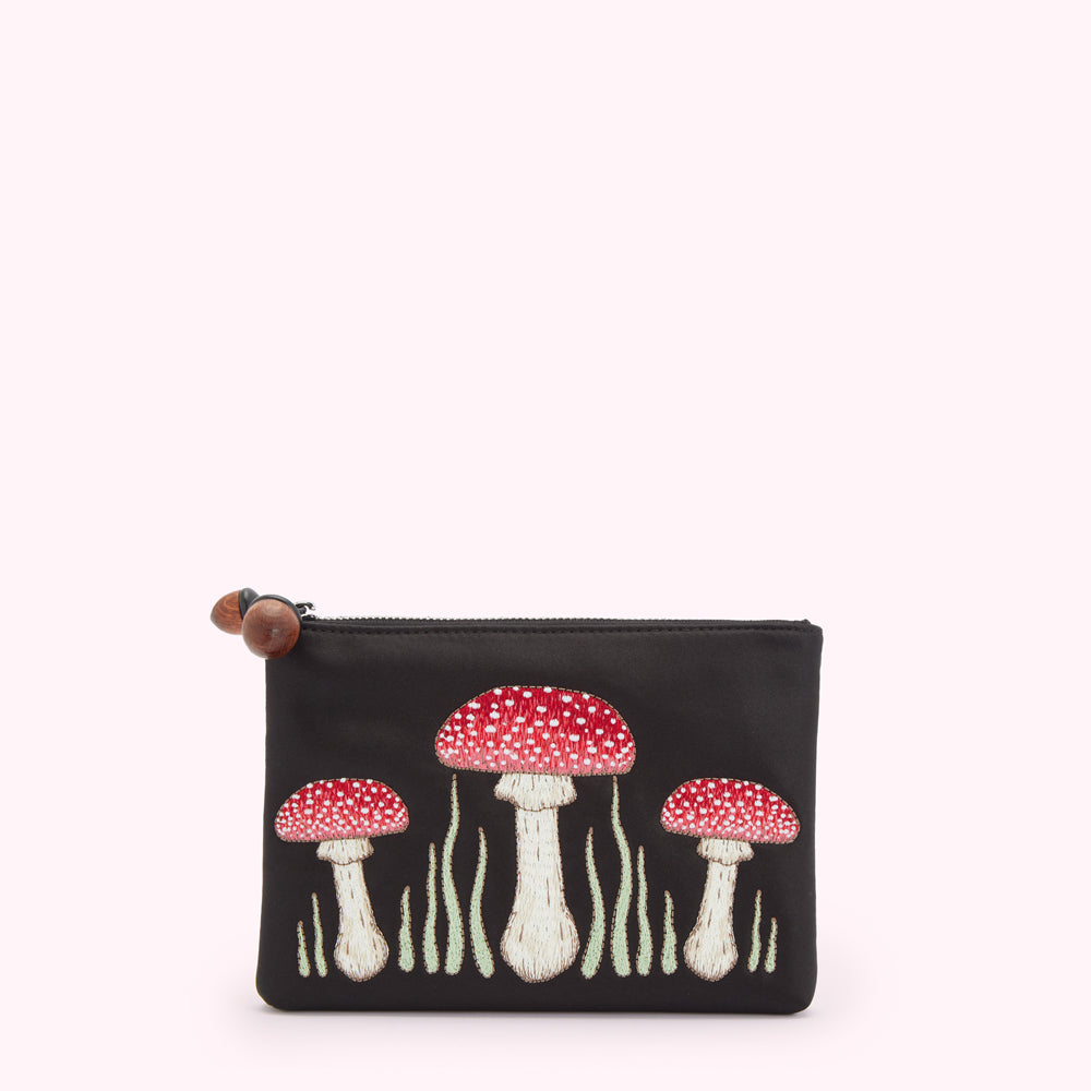 Black satin pouch with embroidered red and white mushrooms.
