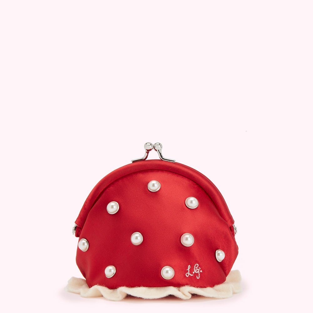 Red satin coin purse with pearl accents and cream trim against a white background.
