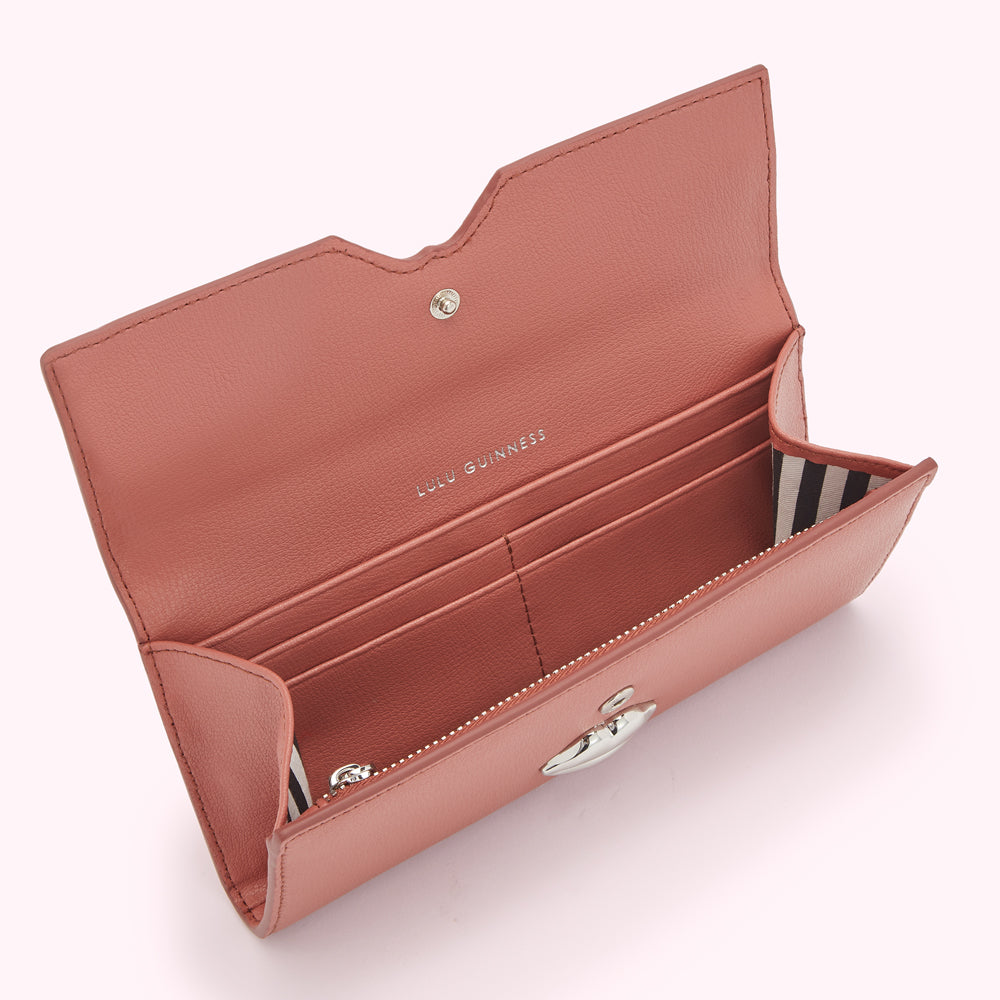 Open dusty rose Lulu Guinness wallet with silver clasp.