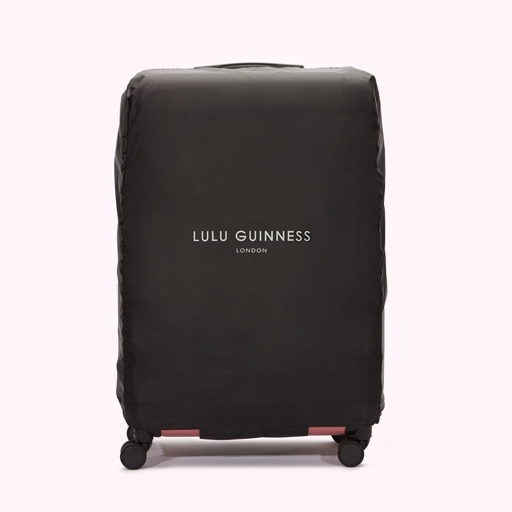 Black Lulu Guinness London luggage cover on a white background.
