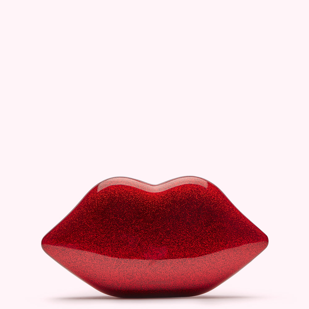 Red glitter lips clutch bag against a white background.
