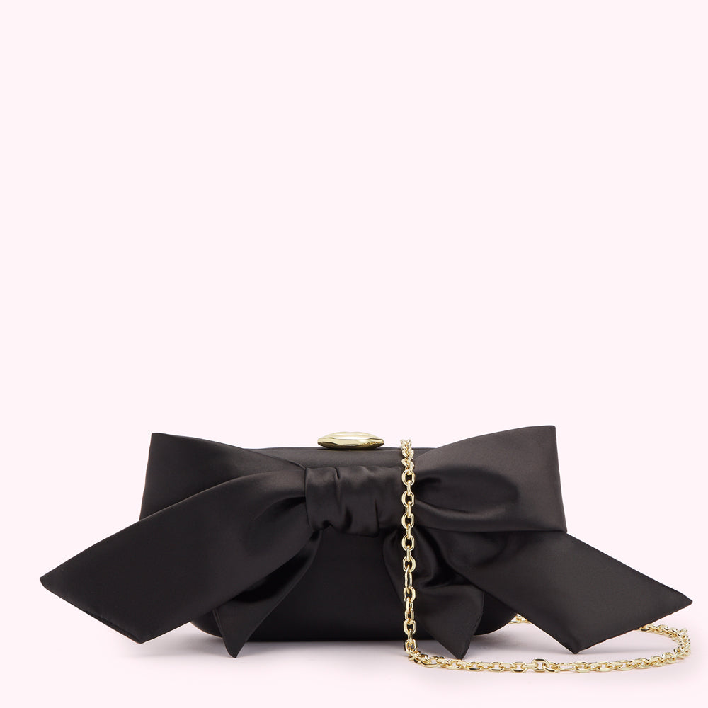 Black satin bow clutch with gold chain strap.
