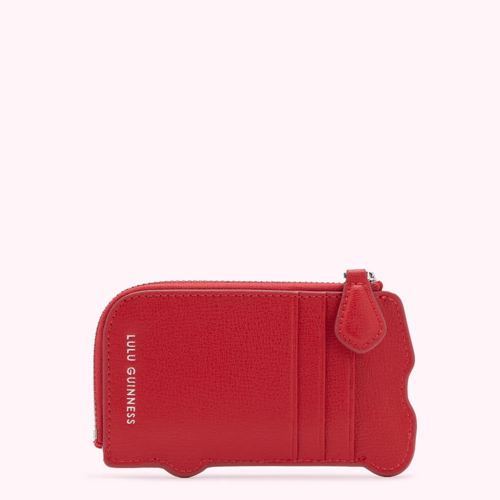 Red Lulu Guinness bus-shaped zip-around cardholder against a white background.
