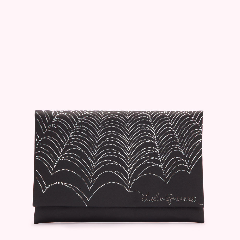 Black clutch with silver embellishments in an arc pattern, Lili G Guinness logo.
