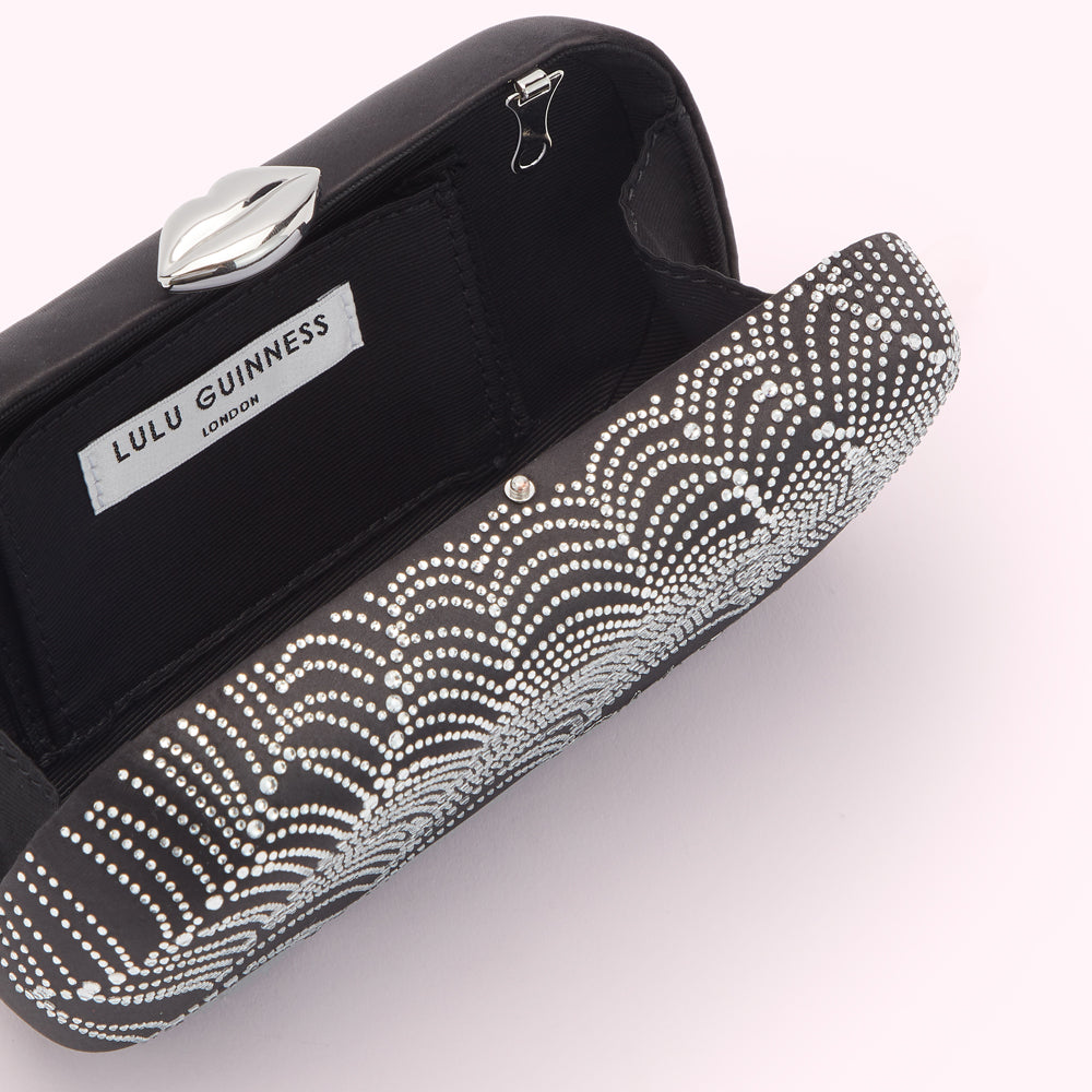 Open black Lulu Guinness clutch with silver crystal detailing and a silver lip-shaped clasp.