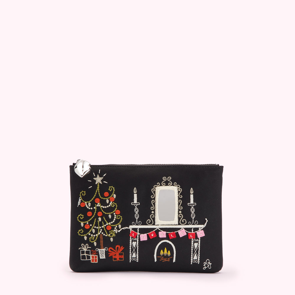 Black pouch with embroidered Christmas scene featuring a tree, fireplace, and mantelpiece.