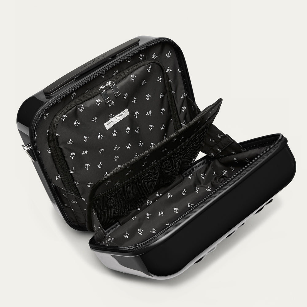 Black vanity case with a subtle pattern on a light gray background