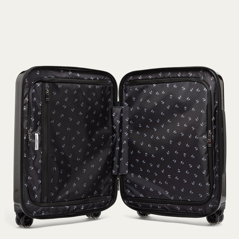 Black suitcase open revealing a  L.G printed lining on a white background
