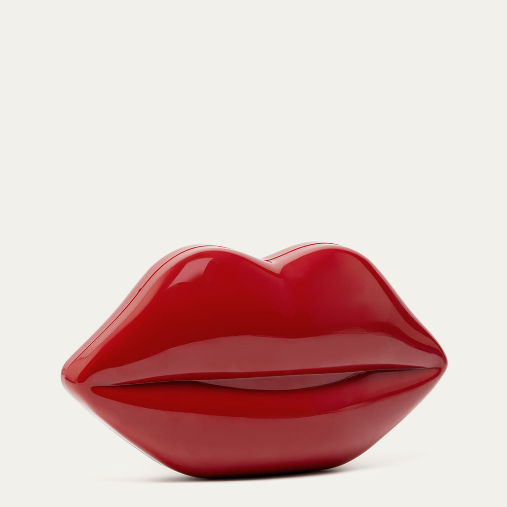 Red lip-shaped clutch on a white background