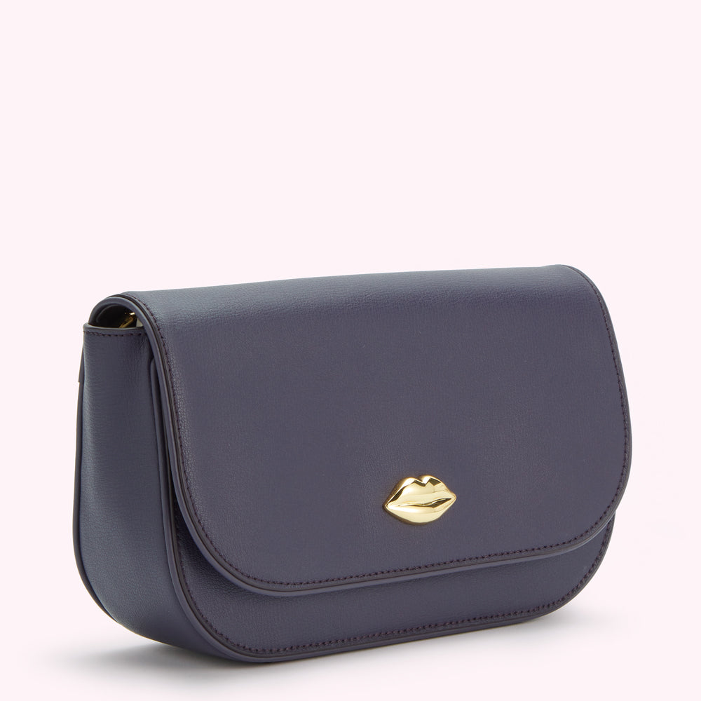 Dark purple leather crossbody bag with gold lip detail.
