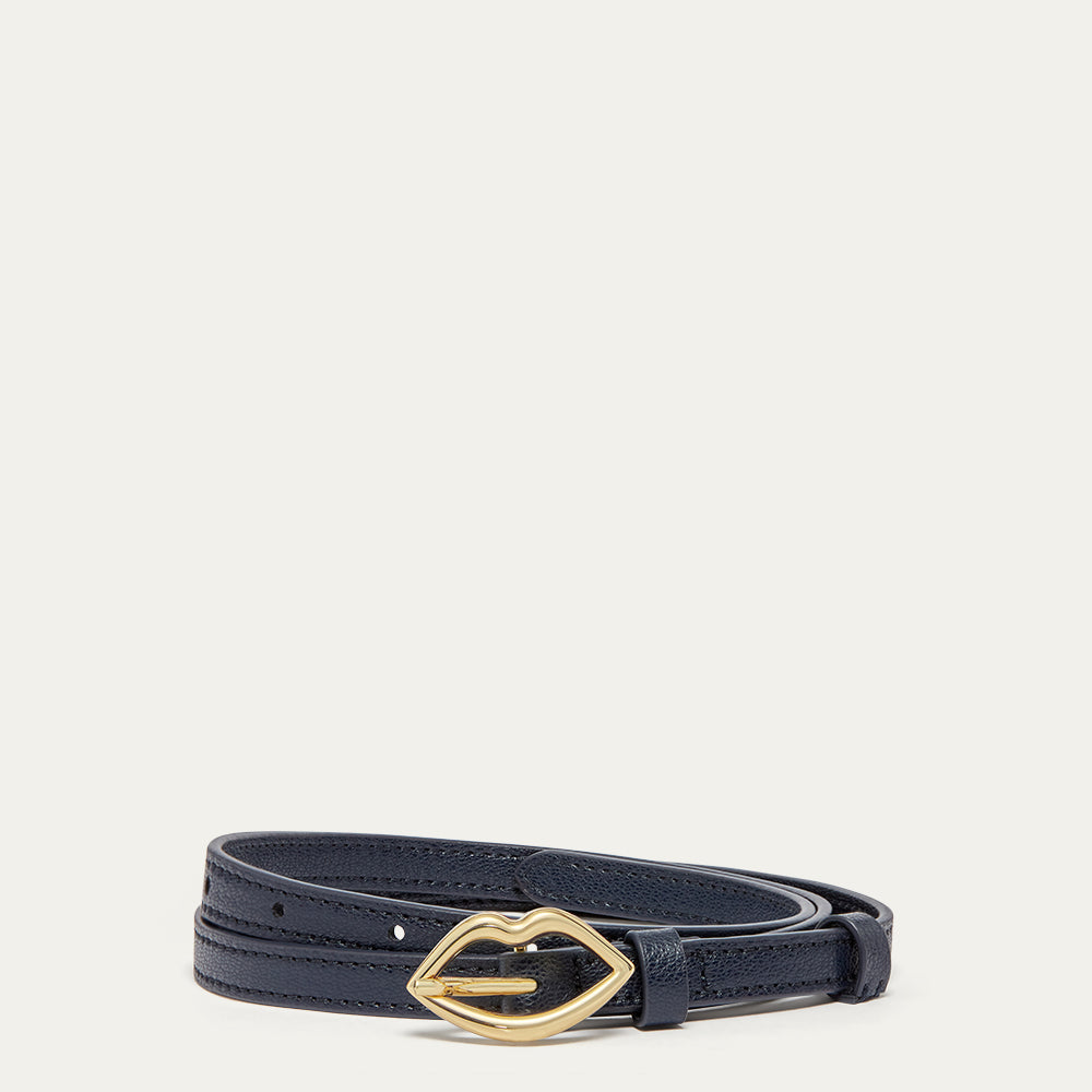 Navy leather belt with a lip-shaped gold buckle on a light grey background
